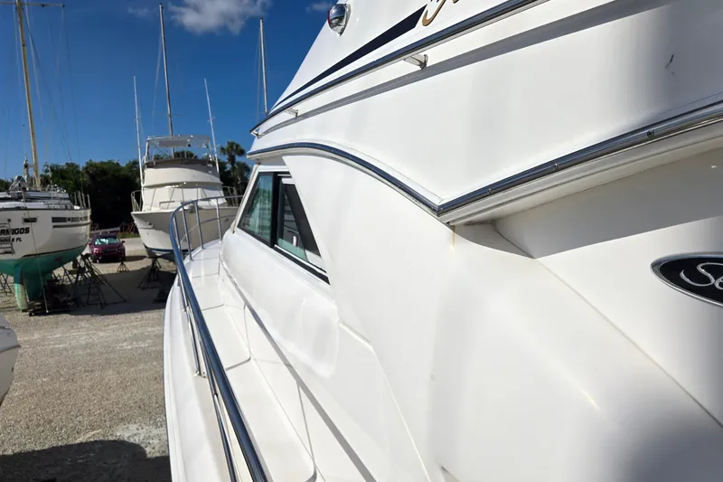 Slide: The Image of 2001 Sea Ray 400 Sedan Bridge cabin with twin beds and elegant decor. - 16