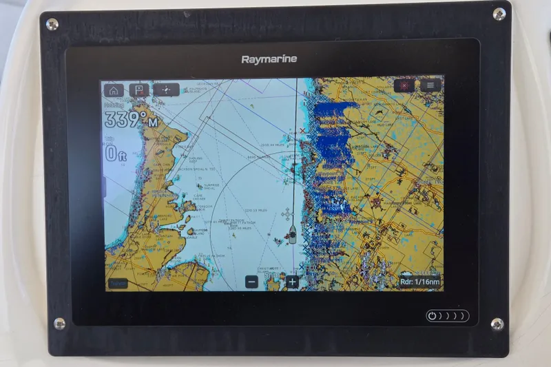 Slide: The Image of 2001 Sea Ray 400 Sedan Bridge yacht illuminated with blue lights at night. - 2