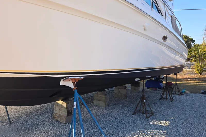 Slide: The Image of Interior of 2001 Sea Ray 400 Sedan Bridge with cooler and seating area. - 20