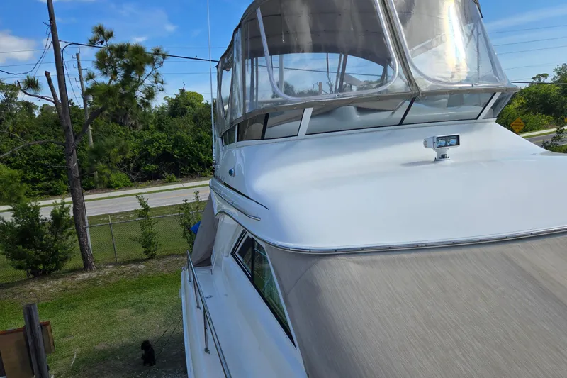 Slide: The Image of Engine compartment of a 2001 Sea Ray 400 Sedan Bridge with visible wiring and components. - 22