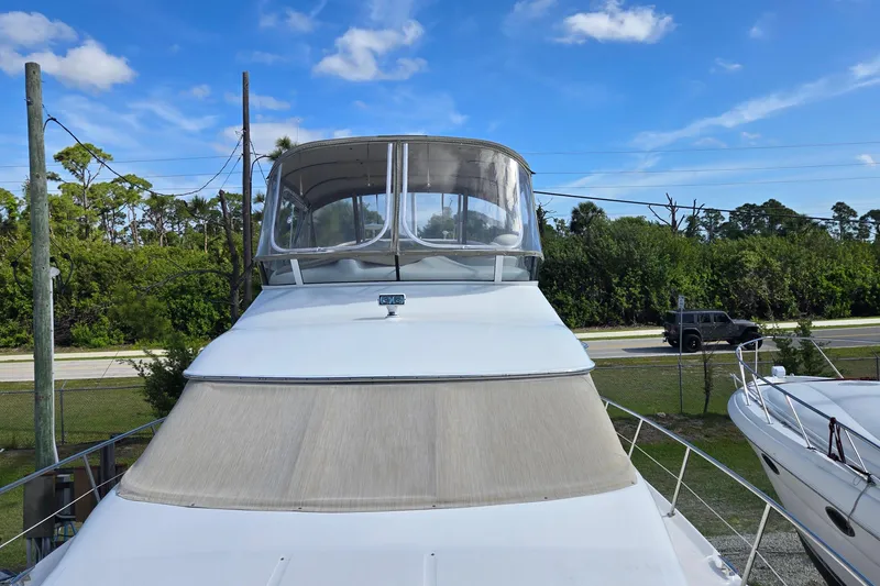 Slide: The Image of Open hatch on 2001 Sea Ray 400 Sedan Bridge deck, showcasing sleek design. - 27