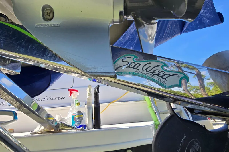 Slide: The Image of 2001 Sea Ray 400 Sedan Bridge yacht in a marina with other boats. - 31