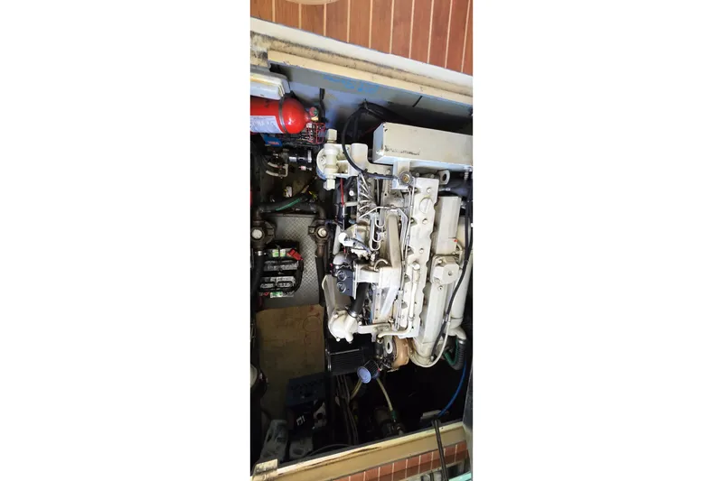 Slide: The Image of 2001 Sea Ray 400 Sedan Bridge yacht docked under clear blue sky. - 34