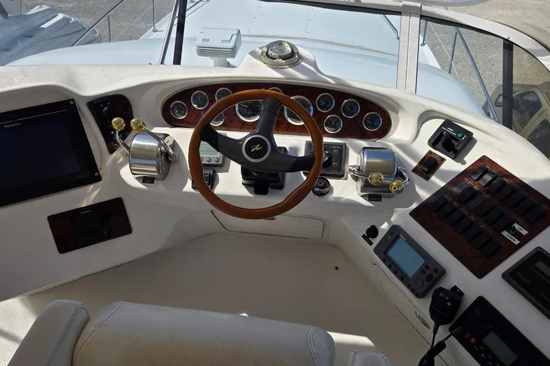 Slide: The Image of Sea Ray 400 Sedan Bridge 2001 at sunrise on misty river, surrounded by trees. - 4