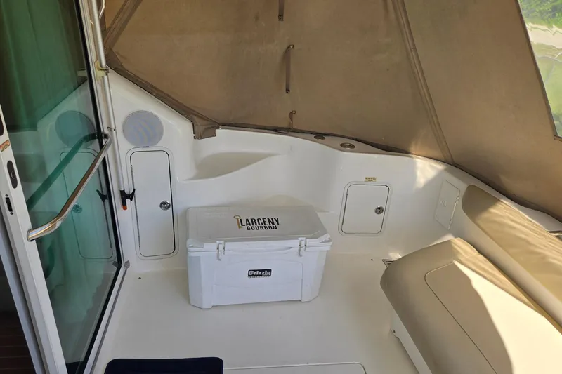 Slide: The Image of Engine room of a 2001 Sea Ray 400 Sedan Bridge, showcasing dual engines and equipment. - 43