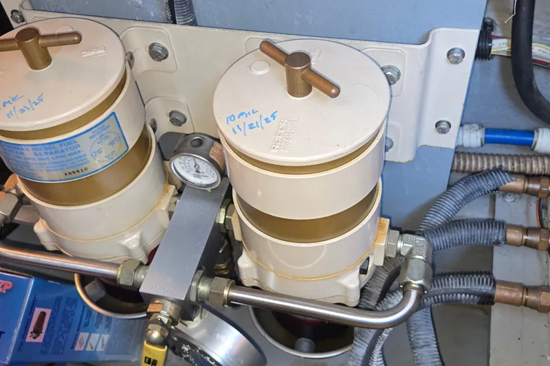 Slide: The Image of Fuel filters and gauge in a 2001 Sea Ray 400 Sedan Bridge engine room. - 53