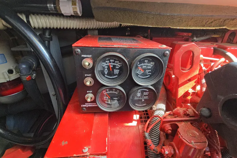 Slide: The Image of Engine control panel of a 2001 Sea Ray 400 Sedan Bridge boat. - 56