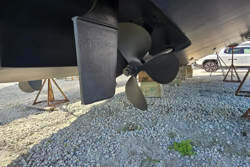 Slide: The Image of Propeller and rudder of 2001 Sea Ray 400 Sedan Bridge on dry dock. - 58