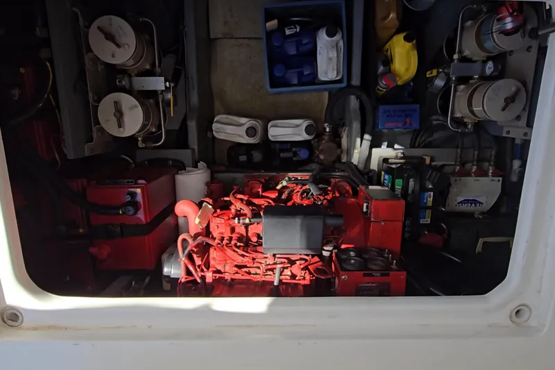 Slide: The Image of Engine room of a 2001 Sea Ray 400 Sedan Bridge with visible components and equipment. - 60