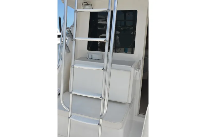 Slide: The Image of Ladder on 2001 Cabo 35 Flybridge boat, leading to upper deck. - 21
