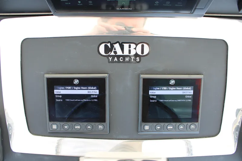 Slide: The Image of Cabo Yachts 35 Flybridge 2001 dashboard with engine hour displays. - 8