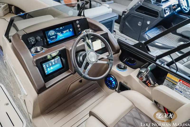 Slide: The Image of Helm of 2026 Bennington 24LXSSB boat with modern controls and digital displays. - 15
