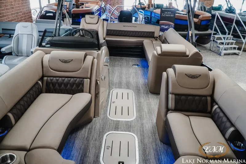 Slide: The Image of 2026 Bennington 24LXSSB pontoon boat interior with luxurious seating at Lake Norman Marina. - 17