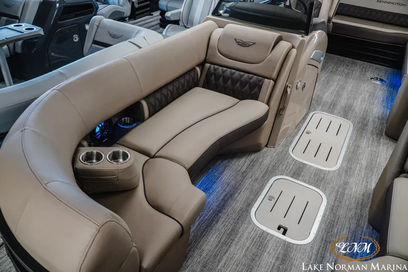Slide: The Image of Luxurious interior of 2026 Bennington 24LXSSB pontoon boat with plush seating and cup holders. - 18