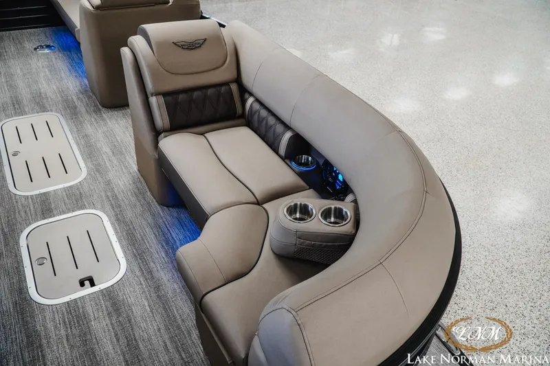 Slide: The Image of Luxurious seating on 2026 Bennington 24LXSSB pontoon boat with cup holders and elegant design. - 19