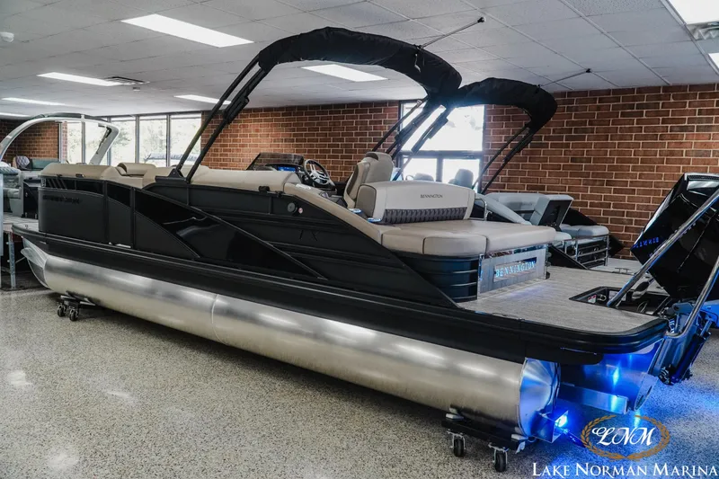 Slide: The Image of 2026 Bennington 24LXSSB pontoon boat displayed indoors at Lake Norman Marina. - 5
