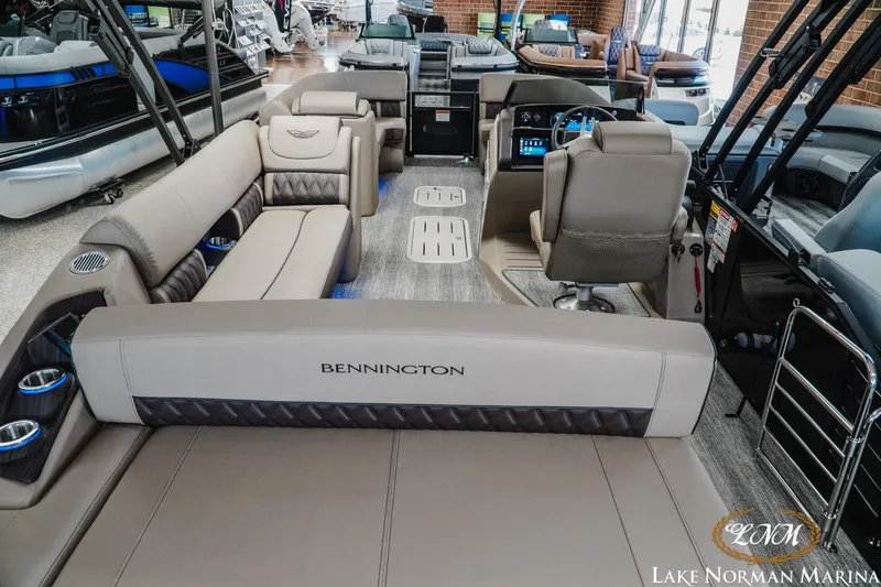 Slide: The Image of 2026 Bennington 24LXSSB pontoon boat interior at Lake Norman Marina showroom. - 9