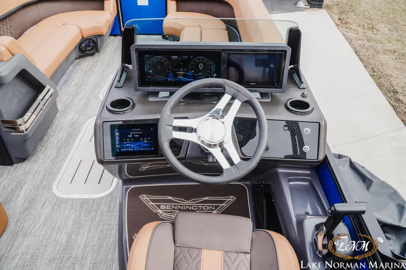 Slide: The Image of 2026 Bennington 24MFB boat dashboard with modern controls and steering wheel at Lake Norman Marina. - 10