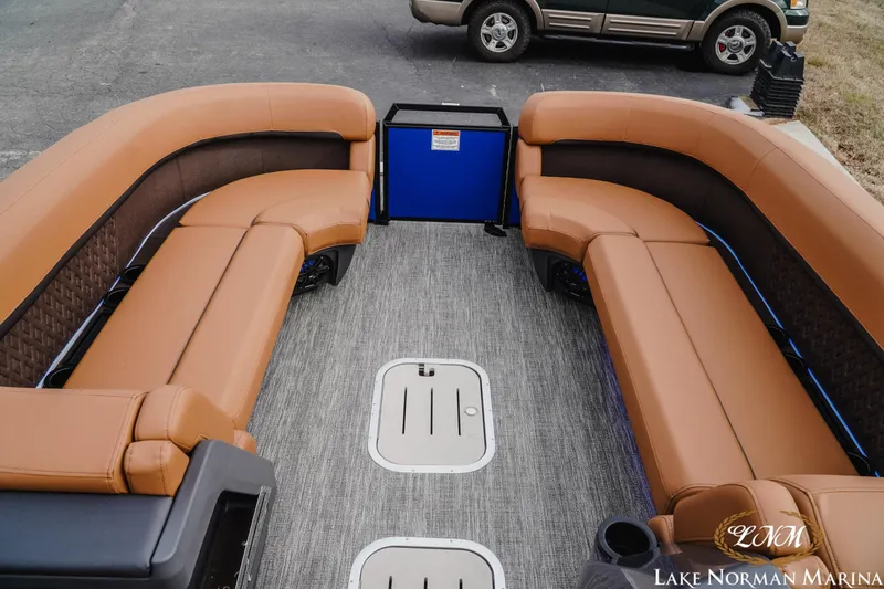 Slide: The Image of 2026 Bennington 24MFB pontoon boat interior with tan seating and gray flooring. - 12