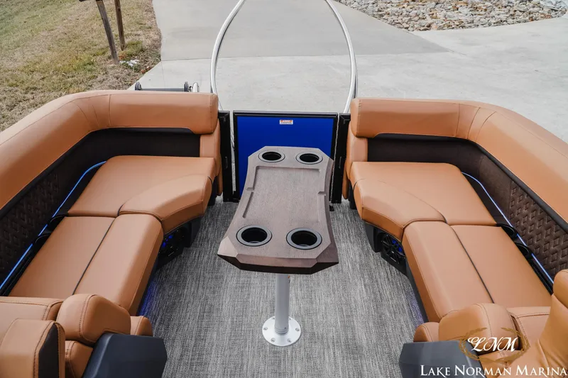Slide: The Image of Luxurious seating area on 2026 Bennington 24MFB pontoon boat with cup holders and elegant design. - 19