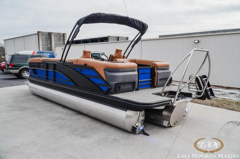 Slide: The Image of 2026 Bennington 24MFB pontoon boat with sleek design at Lake Norman Marina. - 3