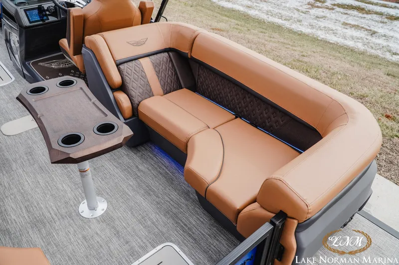 Slide: The Image of Luxurious seating on 2026 Bennington 24MFB boat with cup holders and elegant design. - 7