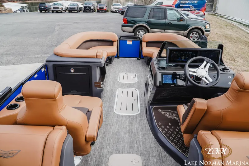 Slide: The Image of 2026 Bennington 24MFB pontoon boat interior with luxurious seating and modern dashboard at Lake Norman Marina. - 8