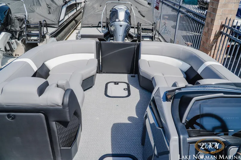 Slide: The Image of Luxurious 2026 Evotti 723CS pontoon boat interior with plush seating at Lake Norman Marina. - 10