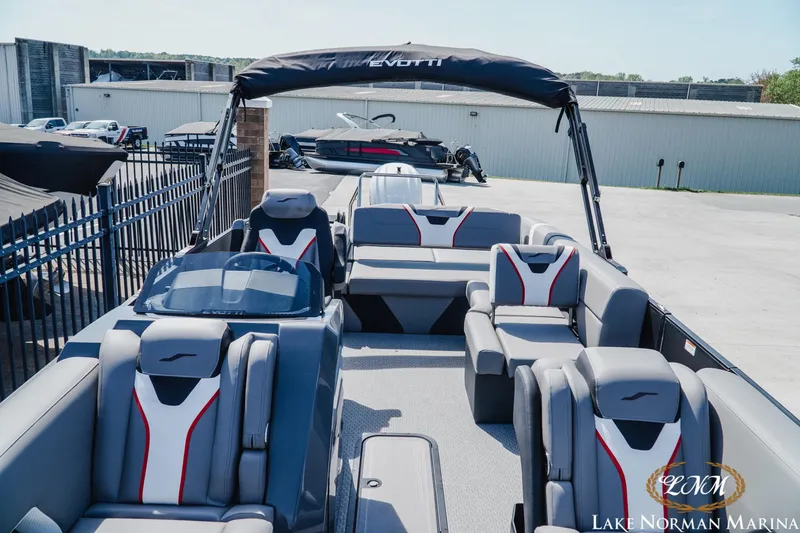 Slide: The Image of Evotti 723CS 2026 pontoon boat with modern seating at Lake Norman Marina. - 12