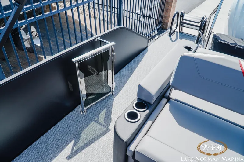 Slide: The Image of 2026 Evotti 723CS boat deck with seating and cup holders at Lake Norman Marina. - 20