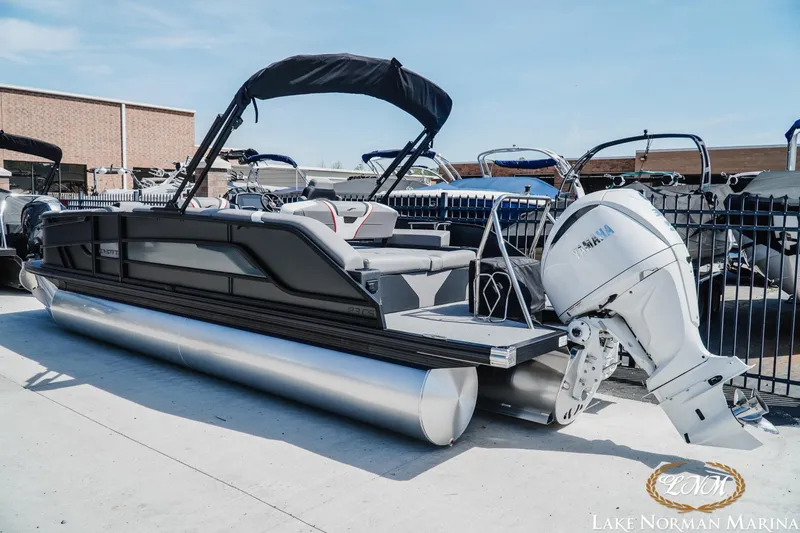 Slide: The Image of 2026 Evotti 723CS pontoon boat with Yamaha outboard motor at Lake Norman Marina. - 3