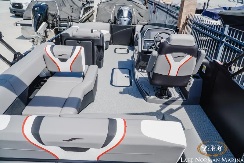 Slide: The Image of 2026 Evotti 723CS boat interior with modern seating and steering, at Lake Norman Marina. - 5
