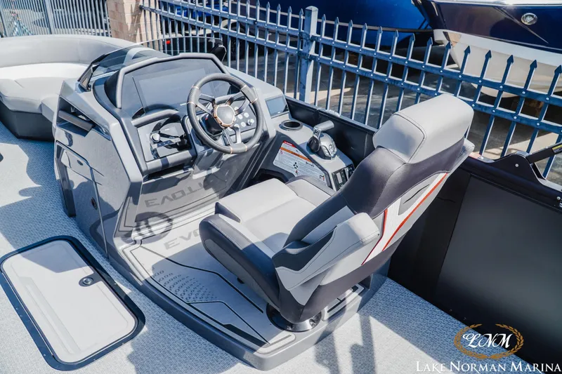 Slide: The Image of 2026 Evotti 723CS boat cockpit with modern steering and seating at Lake Norman Marina. - 7