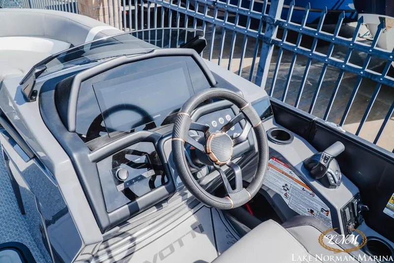 Slide: The Image of Steering console of 2026 Evotti 723CS boat at Lake Norman Marina. - 9