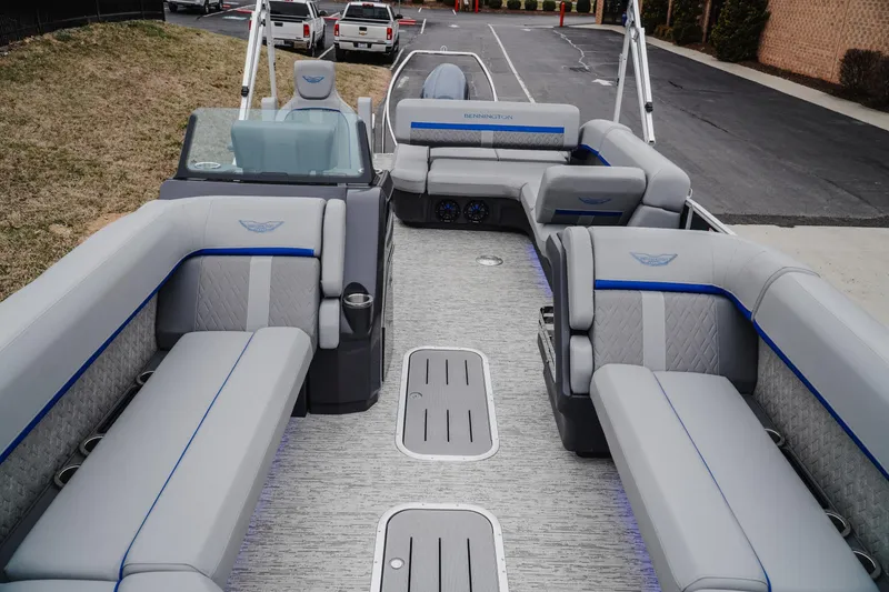Slide: The Image of 2025 Bennington 24MSB pontoon boat with luxurious seating and modern design. - 14