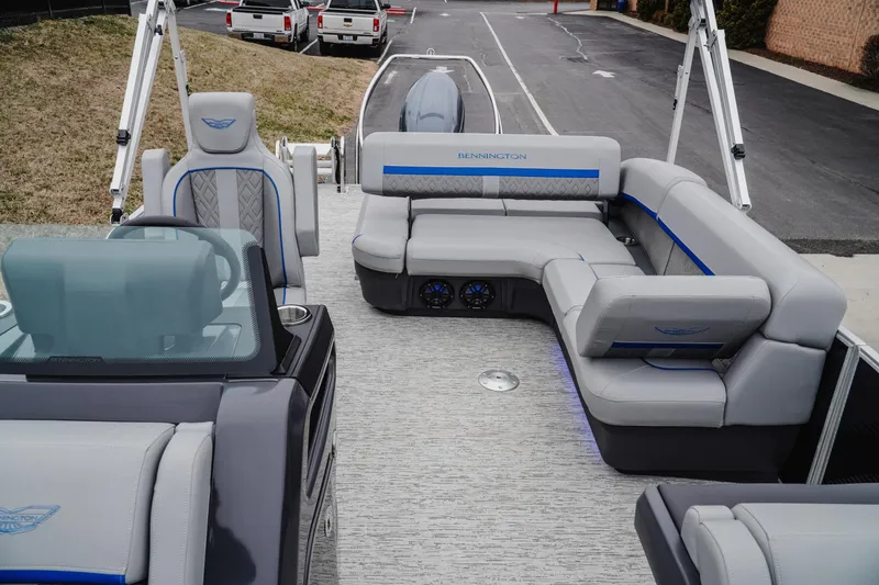 Slide: The Image of 2025 Bennington 24MSB pontoon boat interior with luxurious seating and modern design. - 17