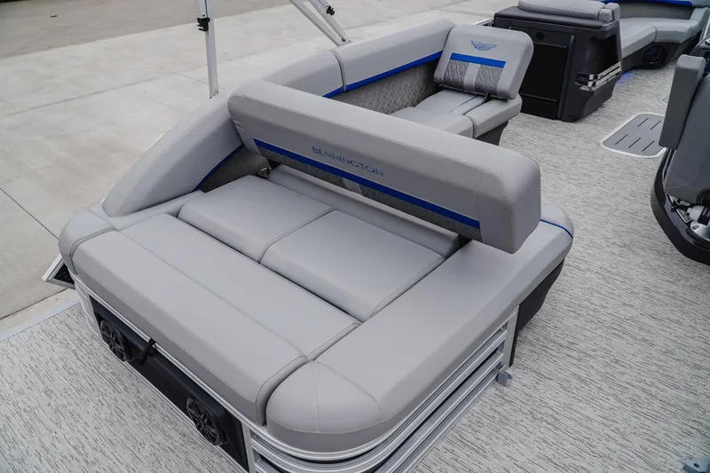 Slide: The Image of 2025 Bennington 24MSB pontoon boat with luxurious gray seating and modern design. - 7