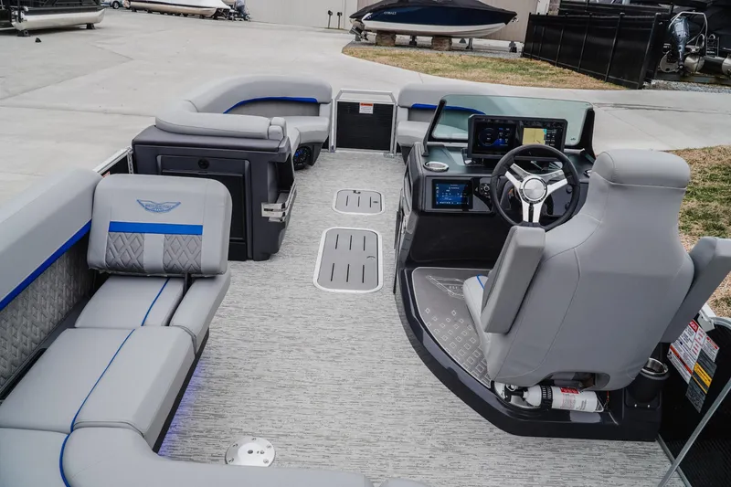 Slide: The Image of 2025 Bennington 24MSB pontoon boat interior with modern helm and spacious seating. - 8