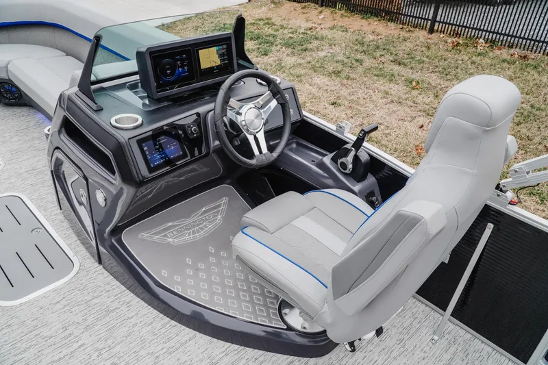 Slide: The Image of 2025 Bennington 24MSB boat helm with modern controls and comfortable seating. - 9