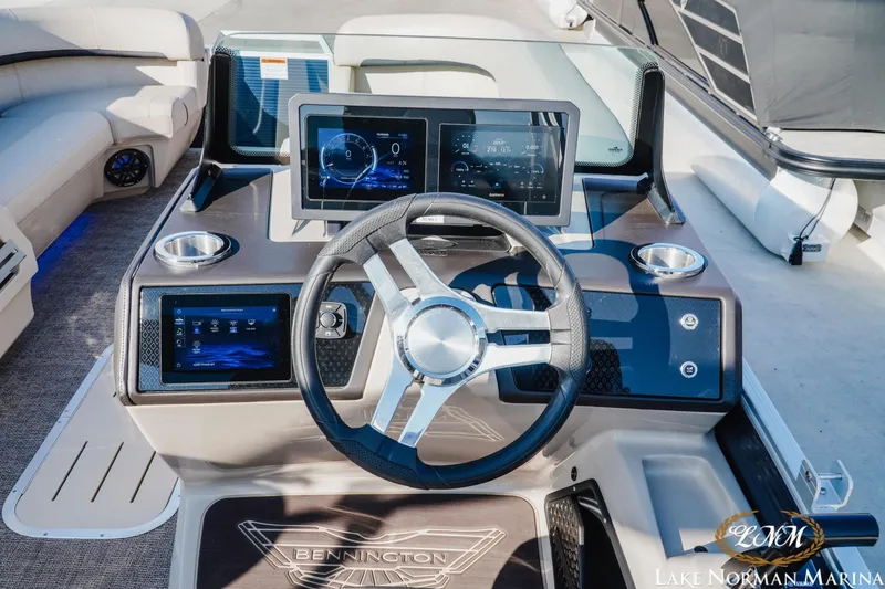 Slide: The Image of 2025 Bennington 24MSB boat dashboard with modern controls and digital displays. - 10