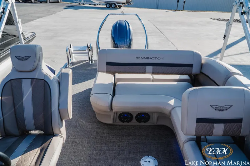 Slide: The Image of 2025 Bennington 24MSB pontoon boat interior with plush seating at Lake Norman Marina. - 16
