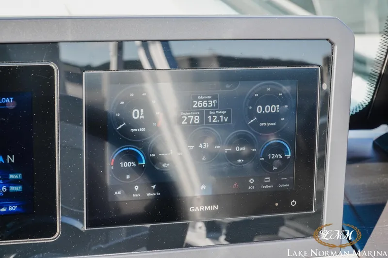 Slide: The Image of Garmin display on 2025 Bennington 24MSB boat showing engine metrics and GPS speed. - 18