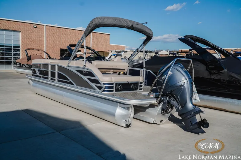 Slide: The Image of 2025 Bennington 24MSB pontoon boat with Yamaha engine at Lake Norman Marina. - 3
