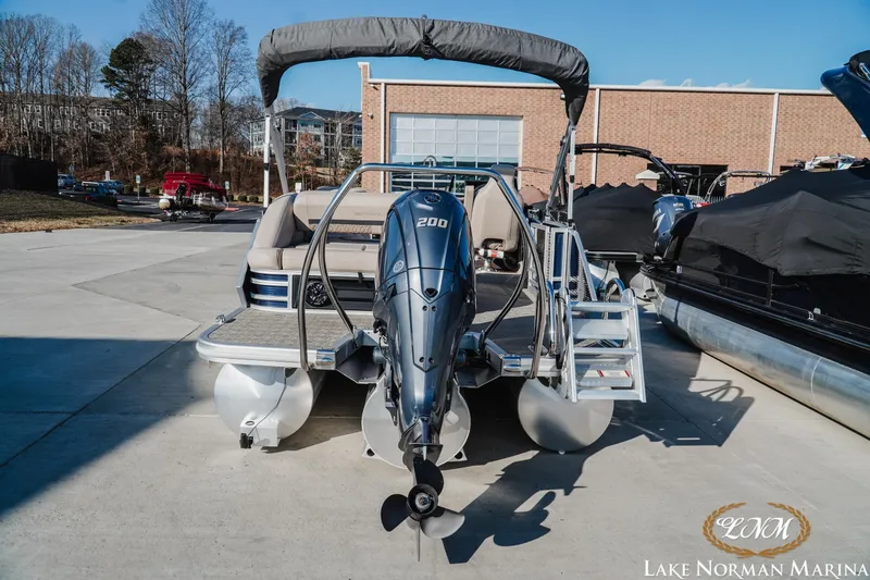 Slide: The Image of 2025 Bennington 24MSB pontoon boat with 200HP engine at Lake Norman Marina. - 4