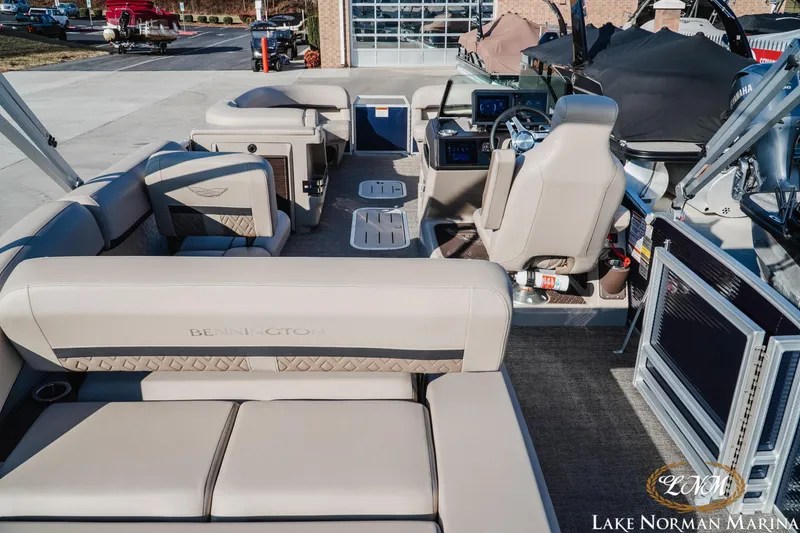 Slide: The Image of 2025 Bennington 24MSB pontoon boat interior with luxurious seating at Lake Norman Marina. - 5