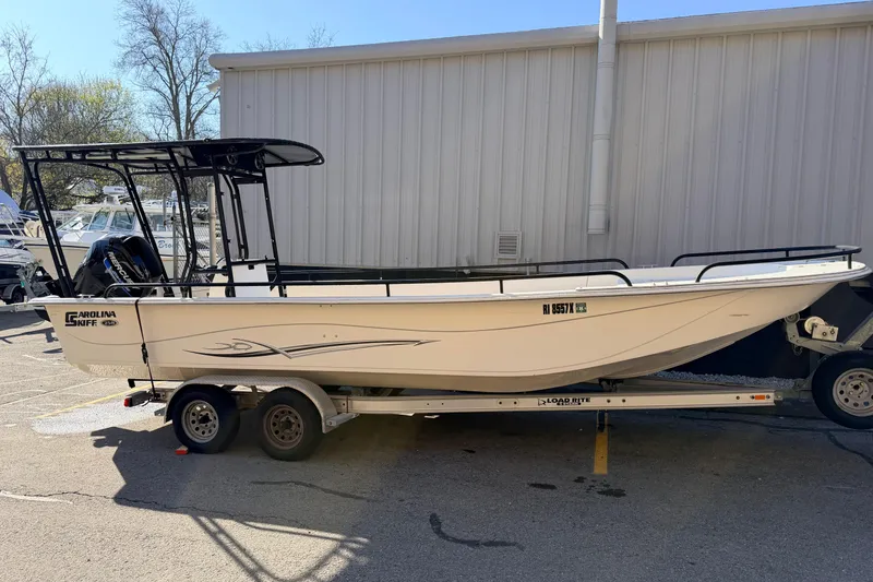 The Image of 2017 Carolina Skiff 258 DLV boat on trailer, parked outdoors. - 0