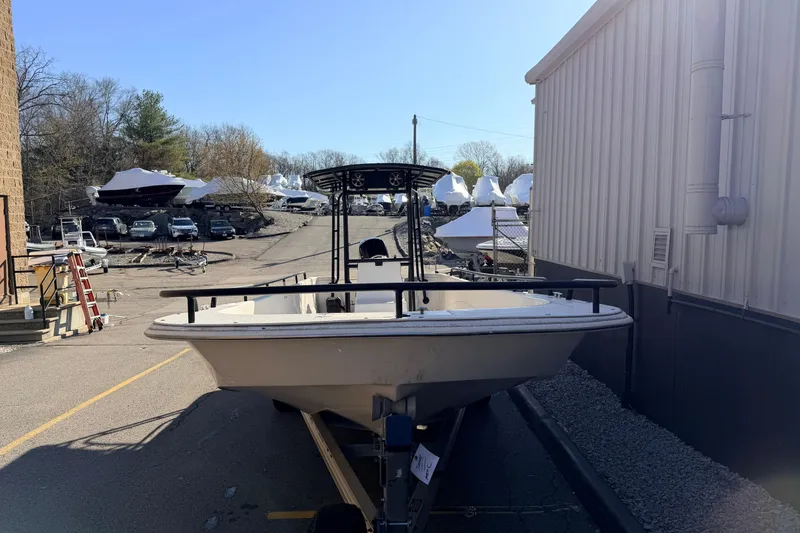 Slide: The Image of 2017 Carolina Skiff 258 DLV boat on trailer near storage facility. - 10