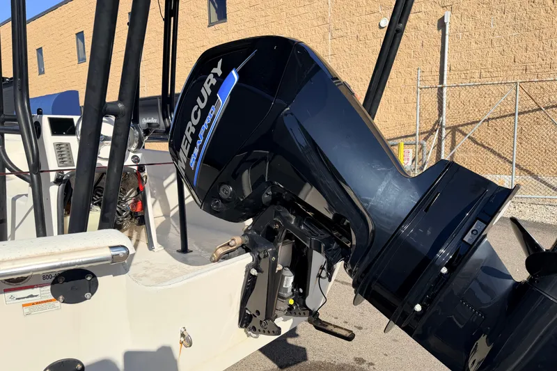 Slide: The Image of 2017 Carolina Skiff 258 DLV with Mercury SeaPro engine, parked outdoors. - 6