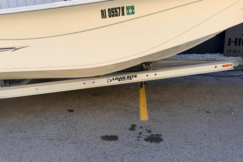 Slide: The Image of 2017 Carolina Skiff 258 DLV boat on Load Rite trailer, parked on asphalt. - 9