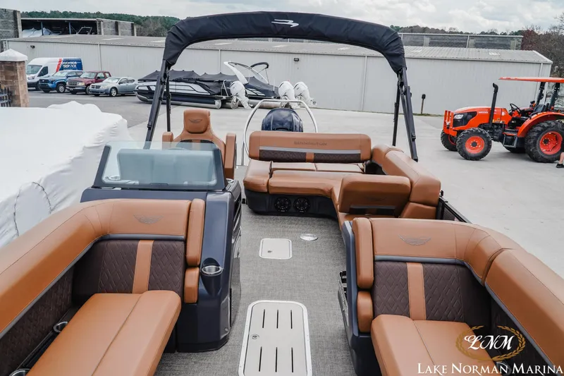 Slide: The Image of 2025 Bennington 24MSB pontoon boat with luxurious seating at Lake Norman Marina. - 12